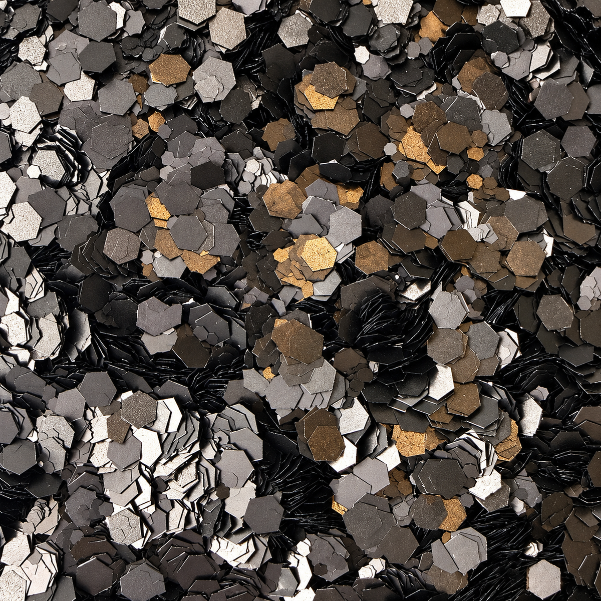 Close-up of Black Tie craft glitter showing mixed-size black and charcoal hexagons with reflective gunmetal highlights.